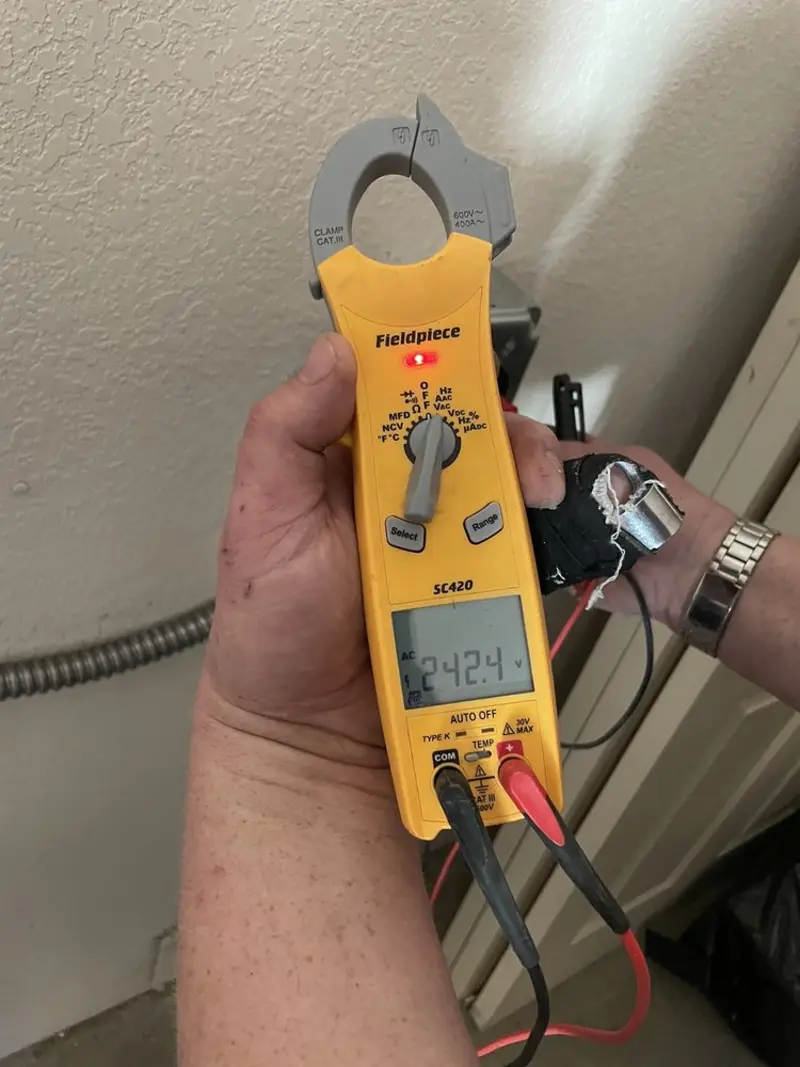 Voltage testing with clamp meter during Outlet Installation in North Mankato